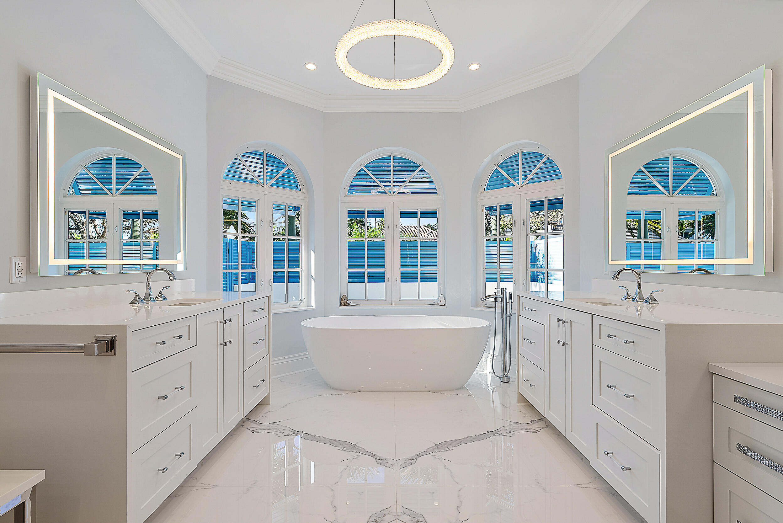 11971 Southeast Tiffany Way Jupiter, FL 33469 - Photo 21 of 53 a spacious bathroom with double vanity a window a double vanity and a bathtub