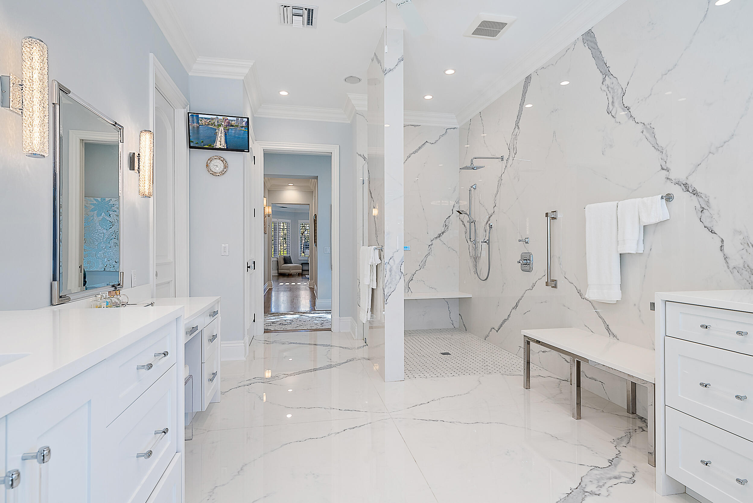 11971 Southeast Tiffany Way Jupiter, FL 33469 - Photo 22 of 53 a spacious bathroom with a double vanity sink a mirror and a shower