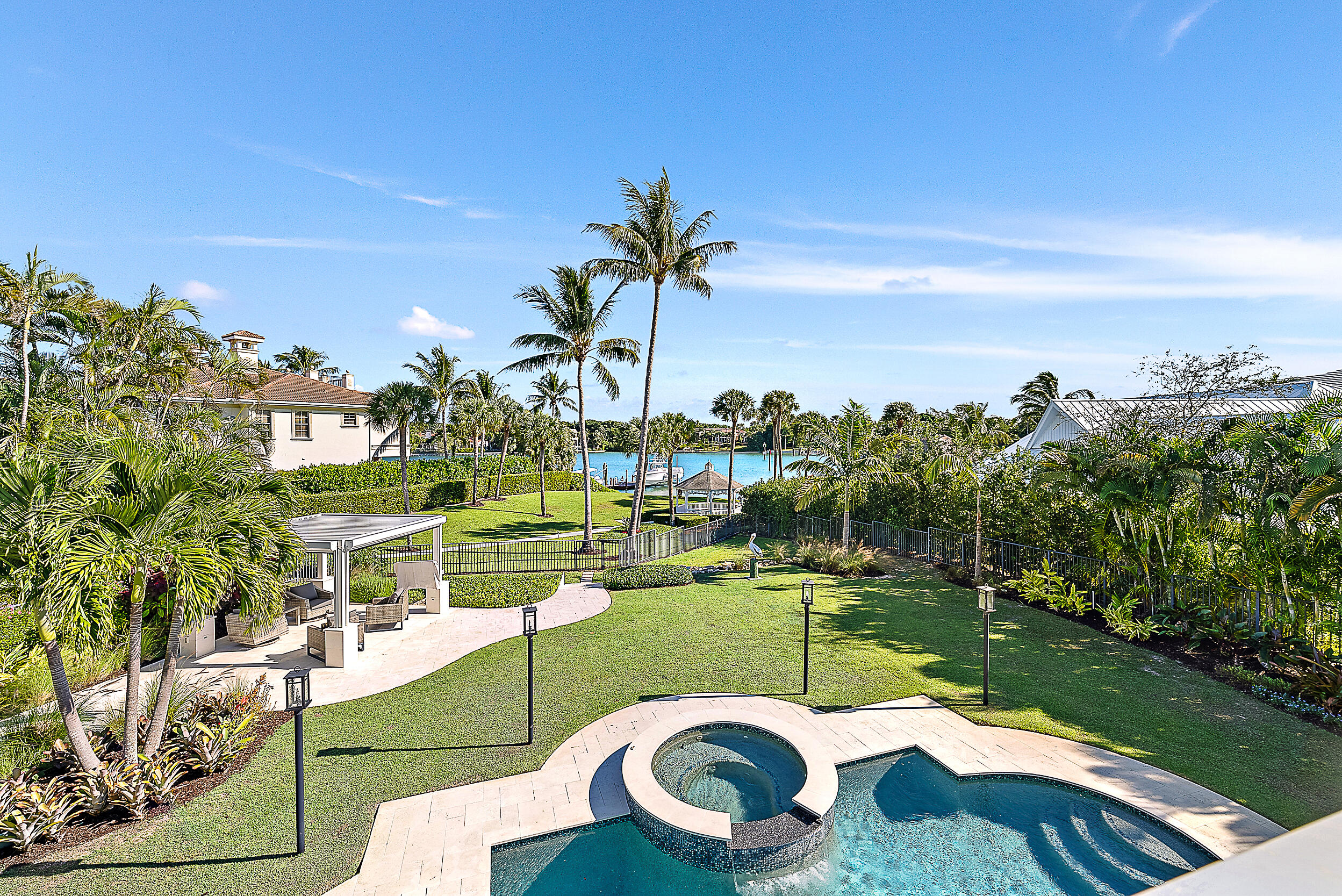11971 Southeast Tiffany Way Jupiter, FL 33469 - Photo 32 of 53 a view of a swimming pool with a patio