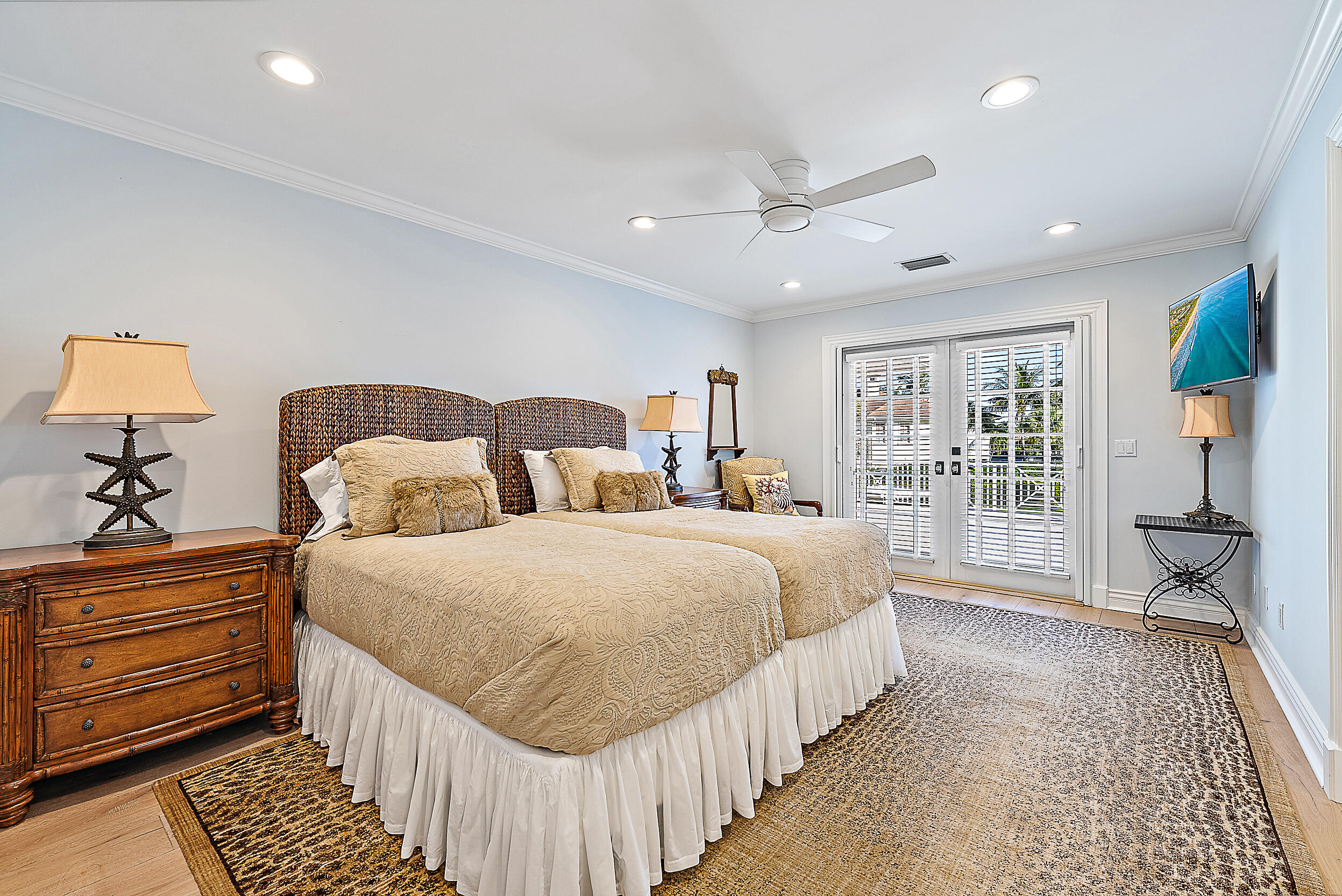 11971 Southeast Tiffany Way Jupiter, FL 33469 - Photo 33 of 53 a bedroom with bed and wooden floor