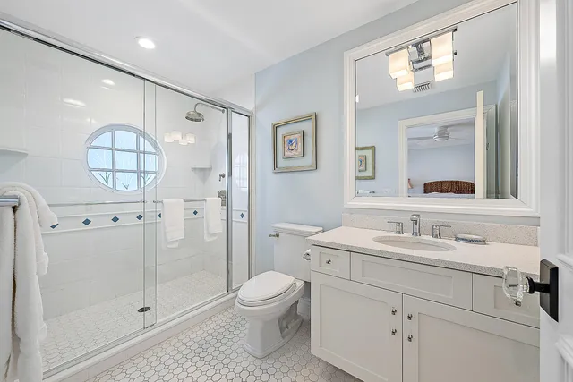 a view of a swimming pool with a yard and palm trees