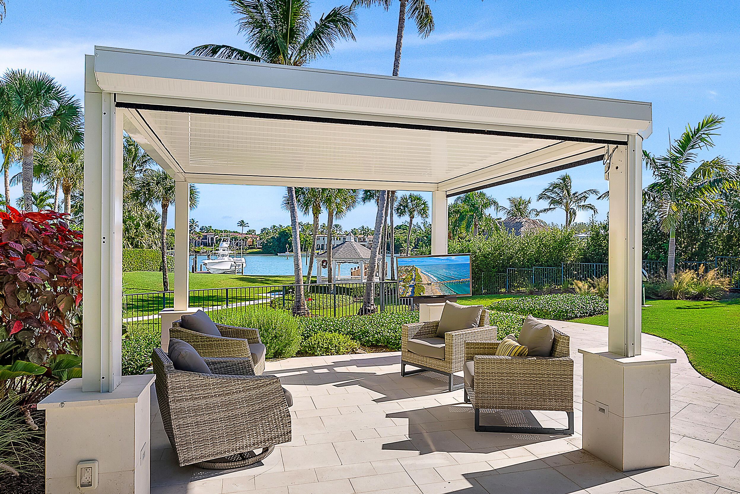11971 Southeast Tiffany Way Jupiter, FL 33469 - Photo 36 of 53 a view of a patio with couches chairs and a big yard