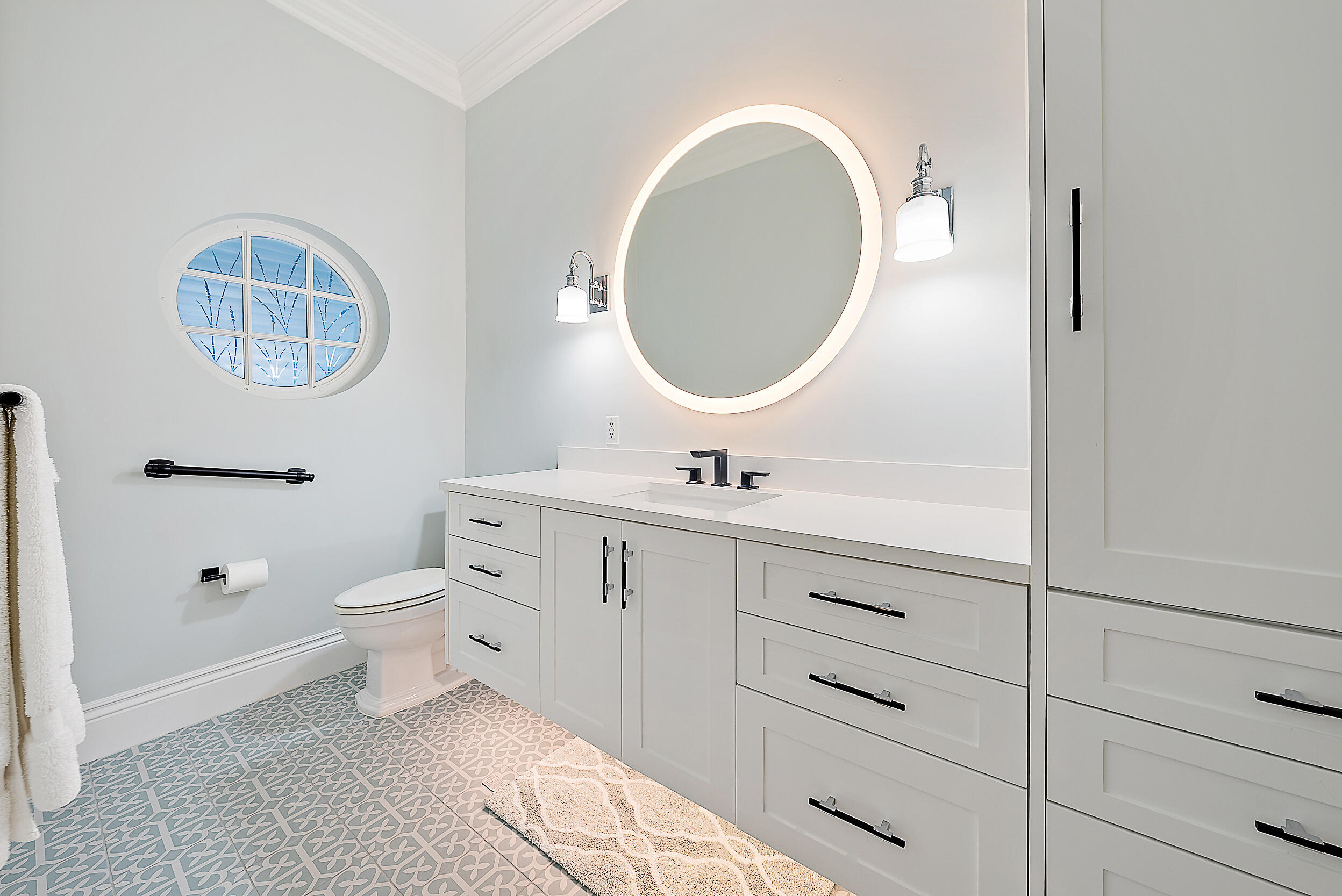 11971 Southeast Tiffany Way Jupiter, FL 33469 - Photo 39 of 53 a bathroom with a toilet a sink and mirror