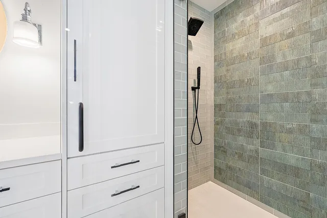 a bathroom with a sink and mirror