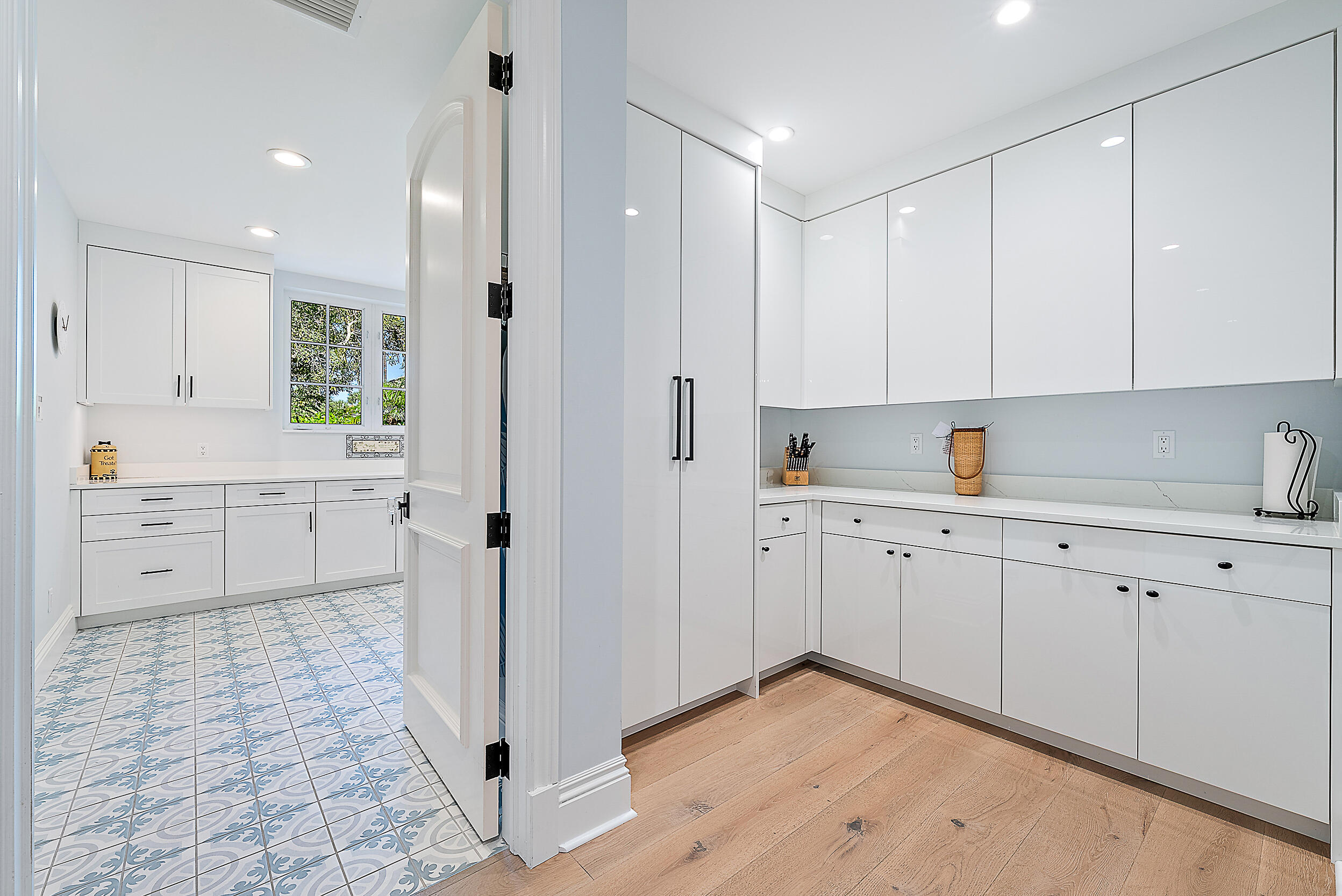 11971 Southeast Tiffany Way Jupiter, FL 33469 - Photo 41 of 53 a kitchen with white cabinets and window