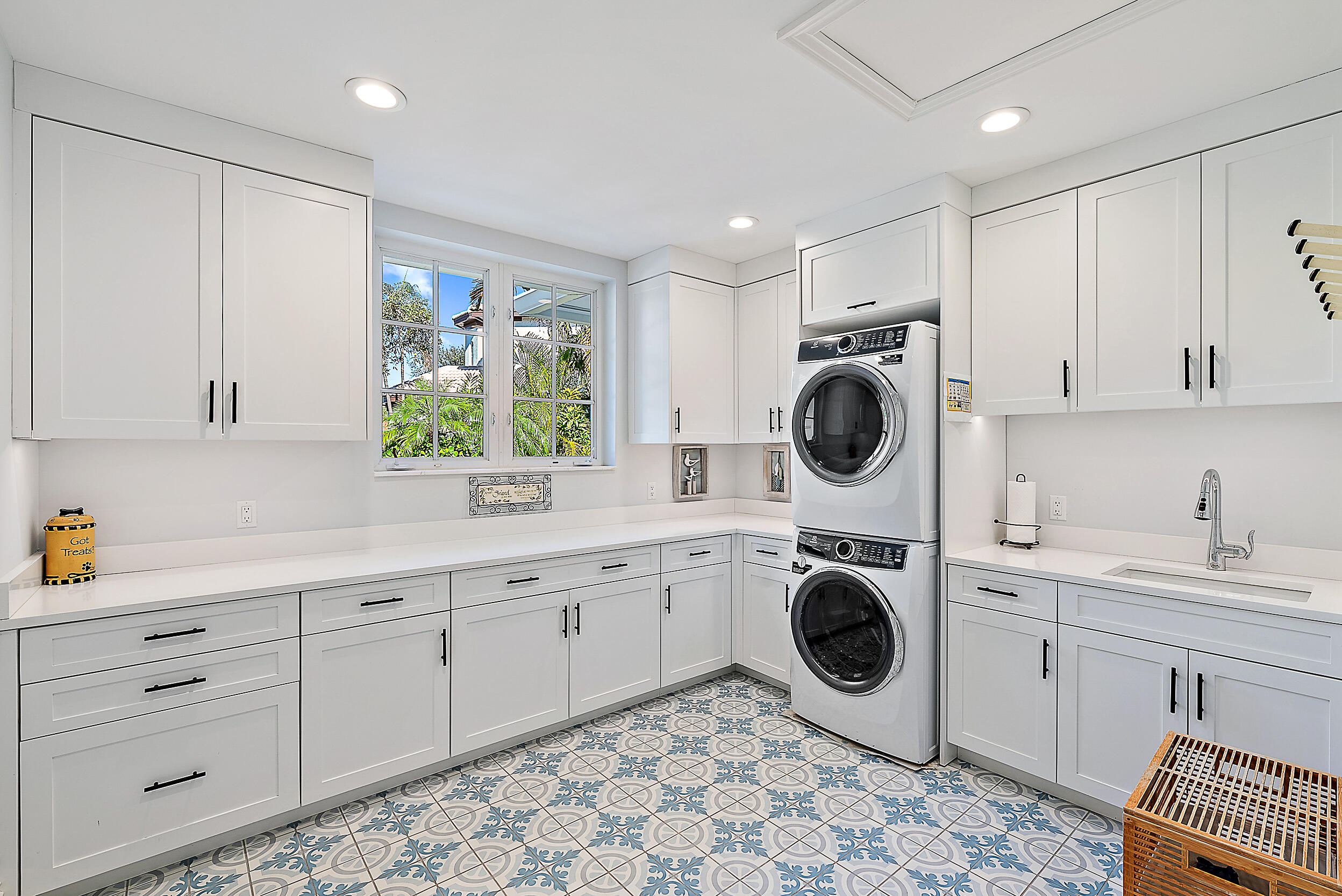 11971 Southeast Tiffany Way Jupiter, FL 33469 - Photo 42 of 53 a kitchen with white cabinets and sink