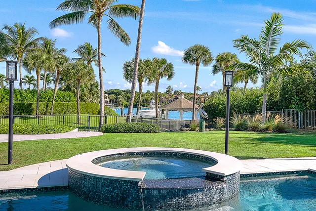 a view of a lake with houses in the back