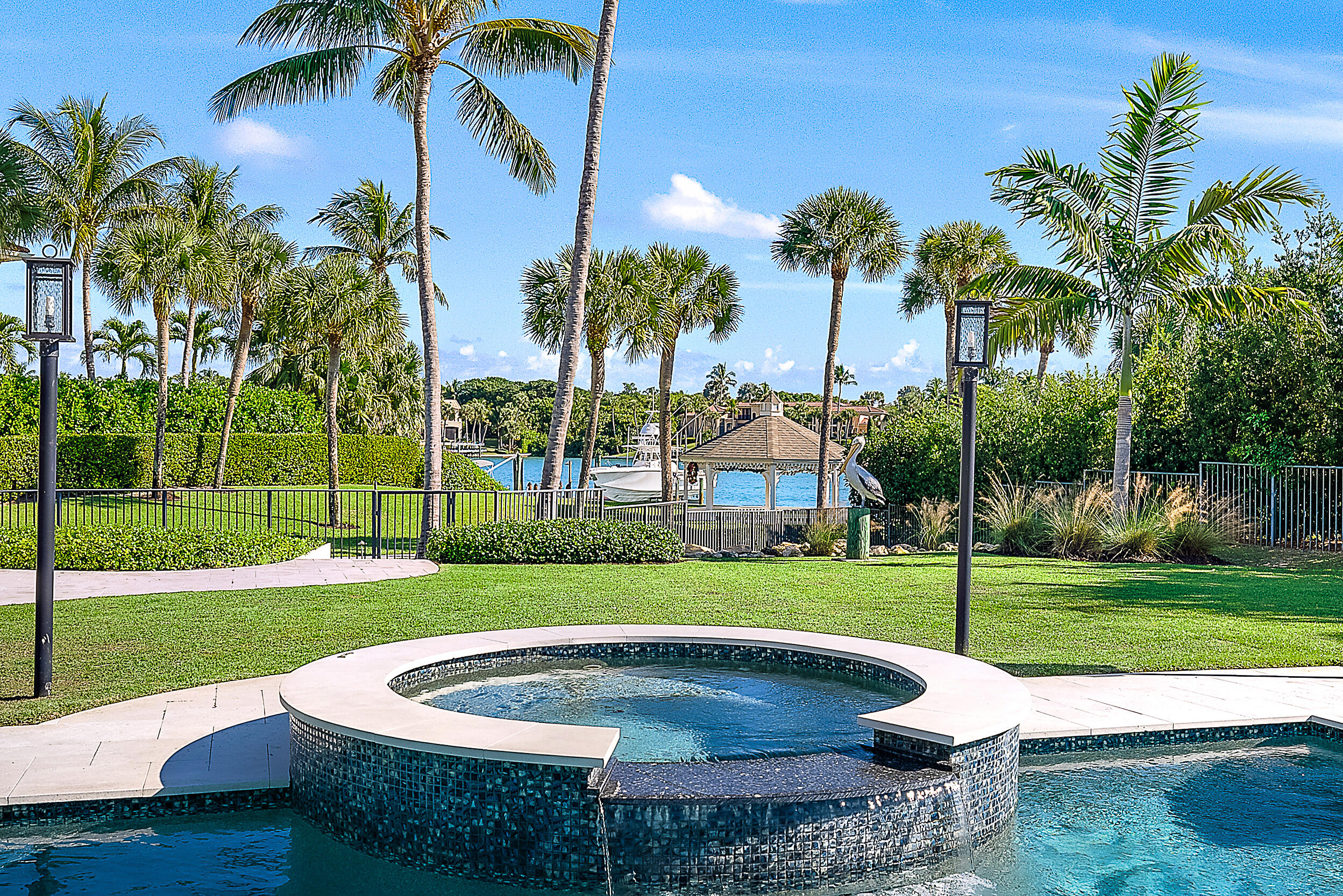 11971 Southeast Tiffany Way Jupiter, FL 33469 - Photo 48 of 53 a view of a house with a swimming pool and a yard