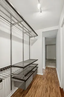 a view of a room with wooden floor