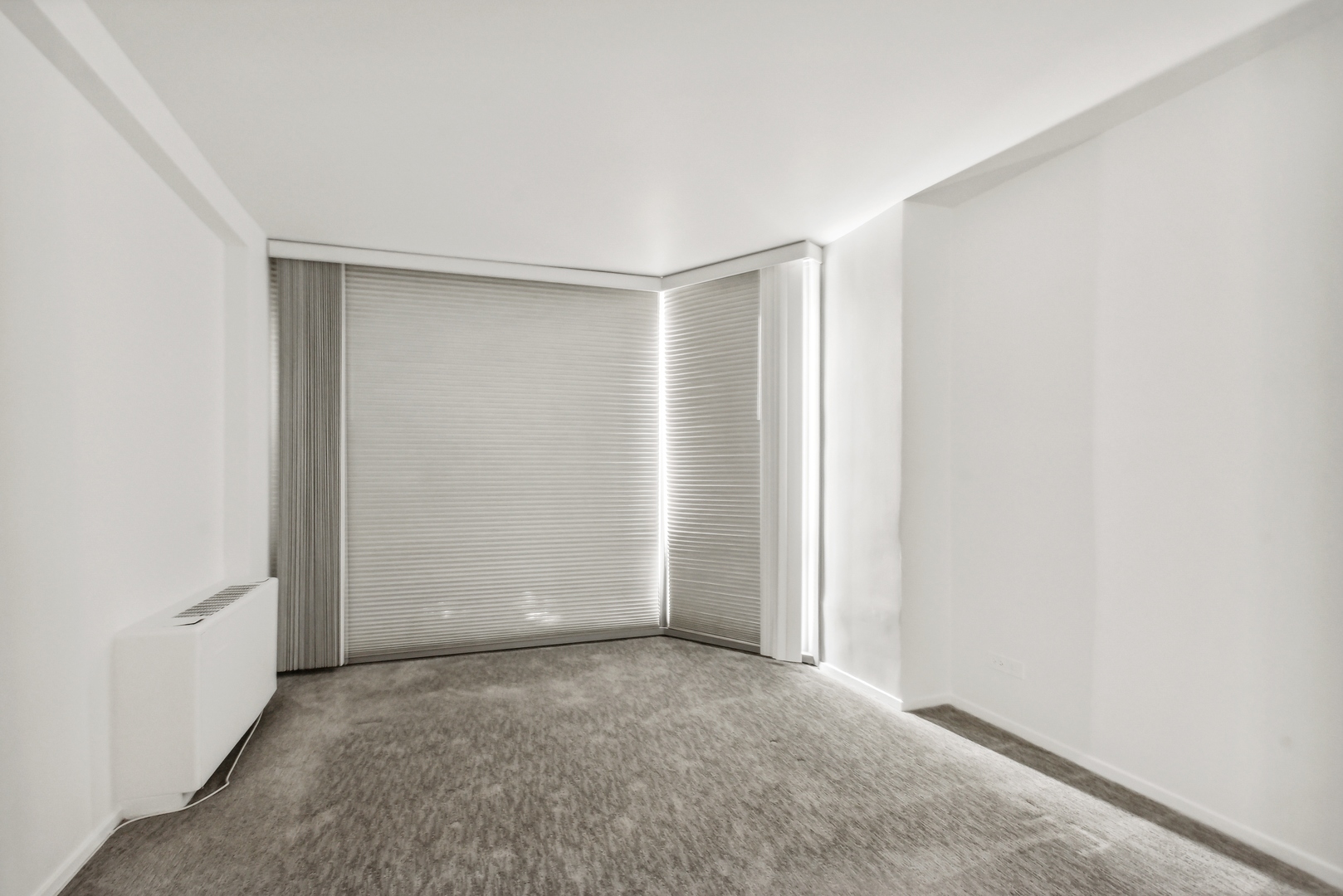 21 West Goethe Street, Unit 17K Chicago, IL 60610 - Photo 10 of 16 an empty room with closet
