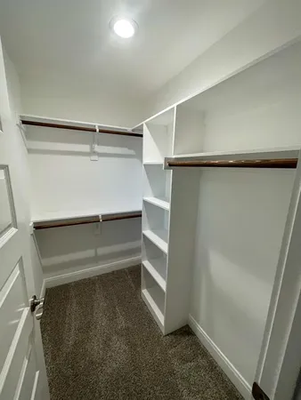 a view of an empty walk in closet