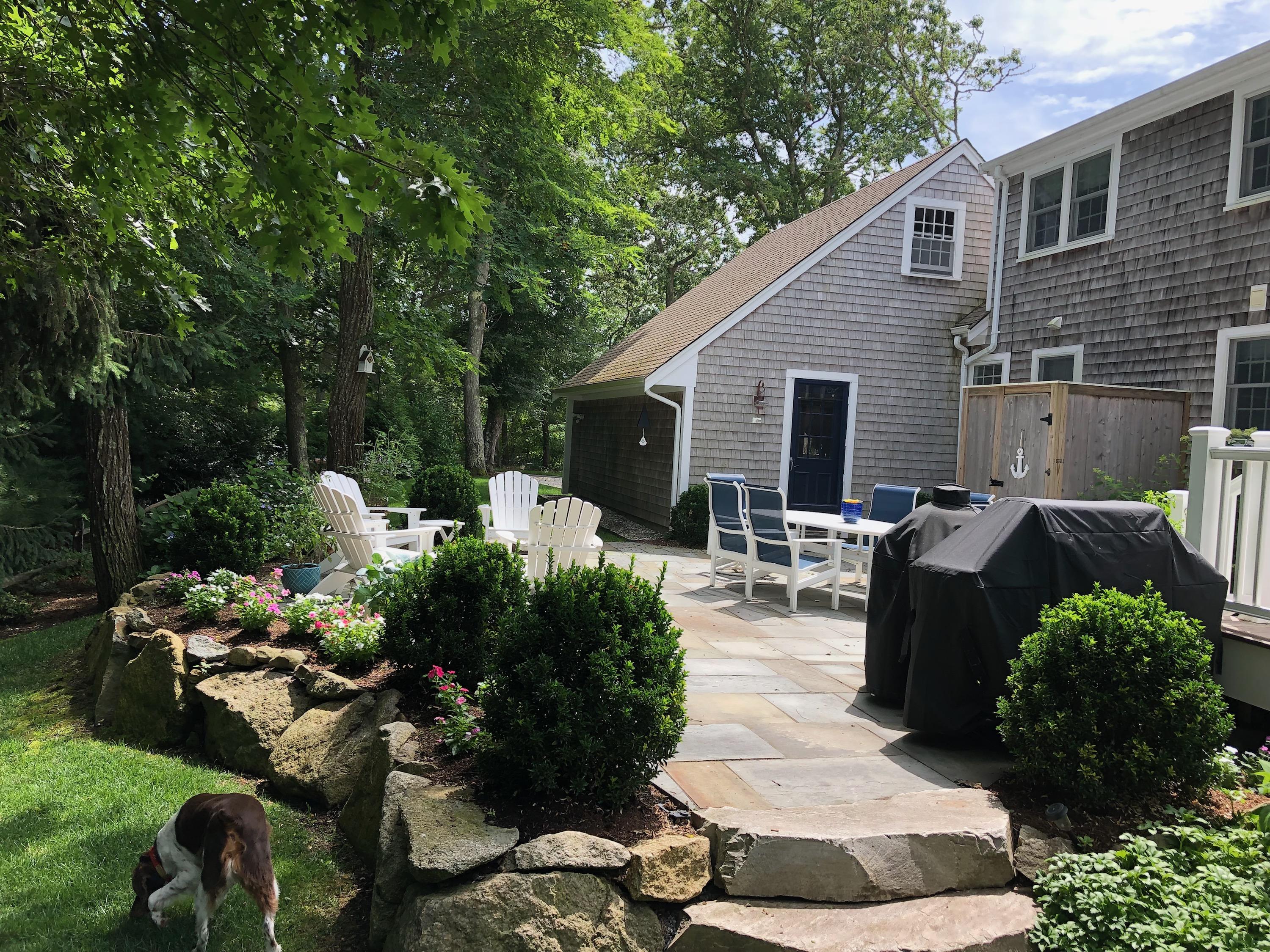 3 Riverview Drive Orleans, MA 02653 - Photo 18 of 63 a view of a backyard with garden and patio