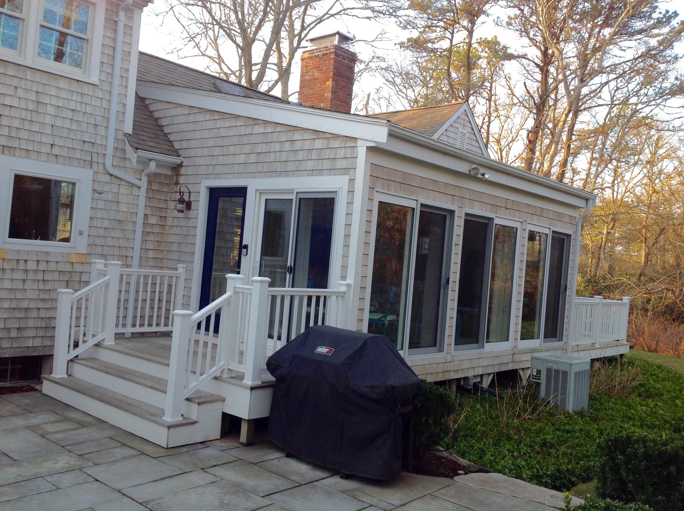 3 Riverview Drive Orleans, MA 02653 - Photo 19 of 63 a view of a house with a large window and wooden fence