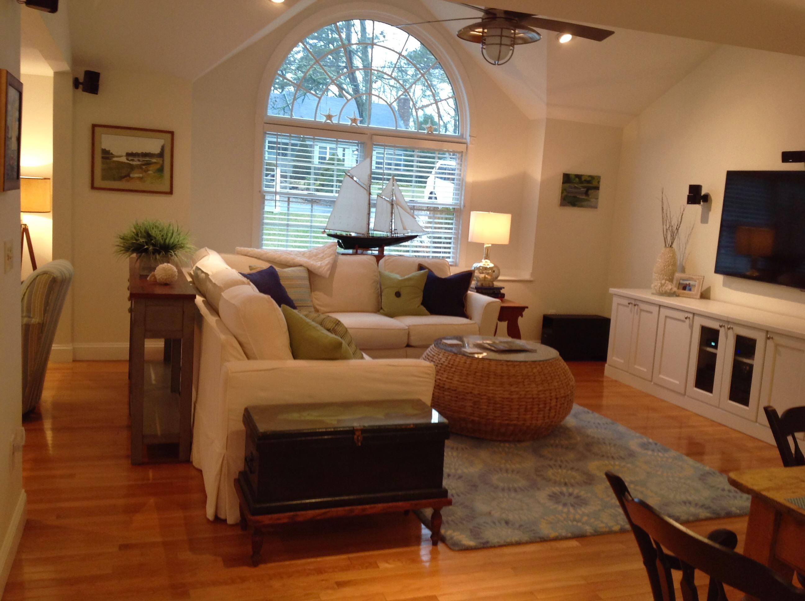 3 Riverview Drive Orleans, MA 02653 - Photo 26 of 63 a living room with furniture a fireplace and a flat screen tv