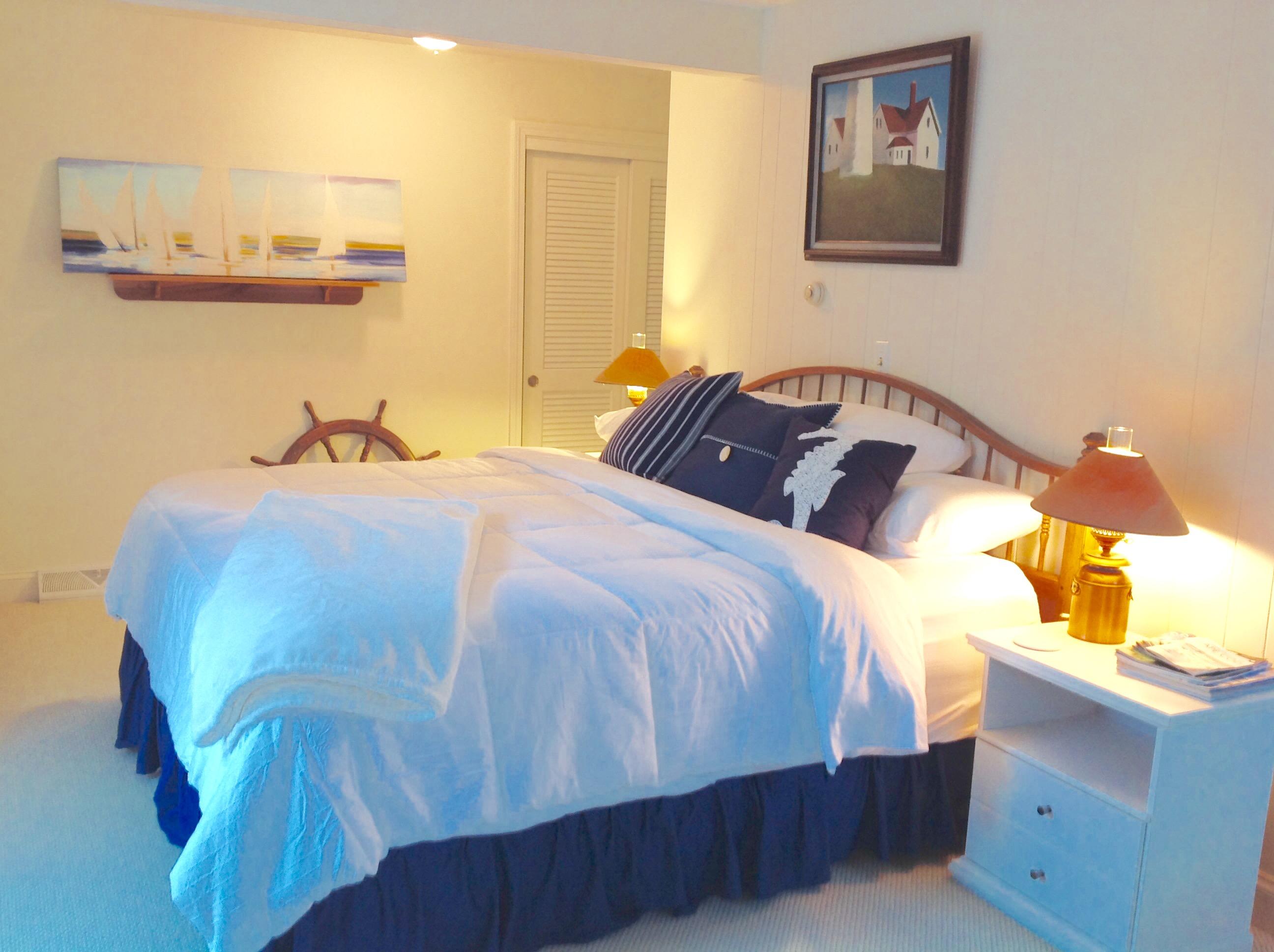 3 Riverview Drive Orleans, MA 02653 - Photo 61 of 63 a bedroom with a bed and painting on the wall