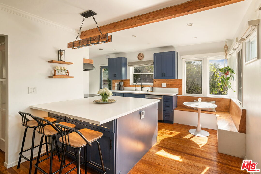 a kitchen with a table and chairs in it
