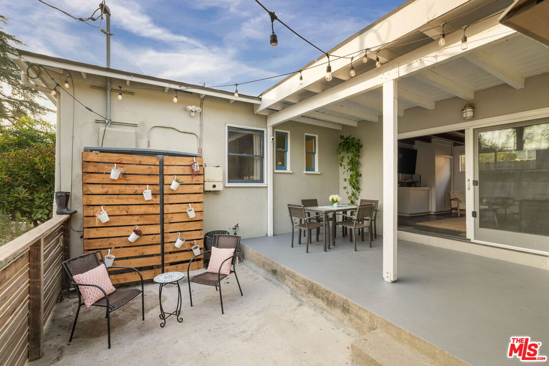 3024 Highview Avenue Altadena, CA 91001 - Photo 19 of 25 a view of a porch with a table and chairs