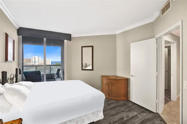 a bedroom with a bed and a cabinets