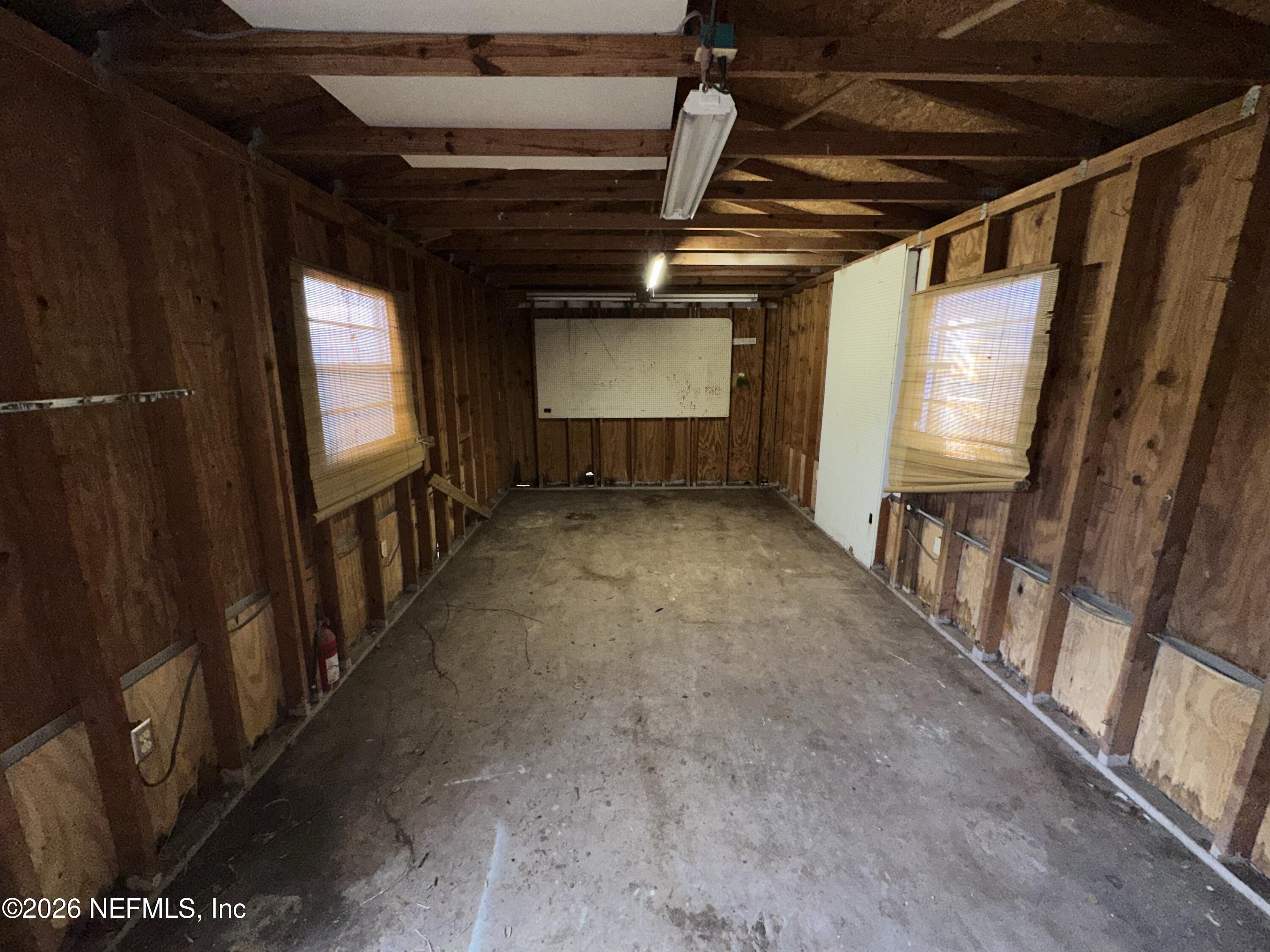 4435 Rainer Road Jacksonville, FL 32210 - Photo 14 of 14 a view of empty room with wooden floor and windows