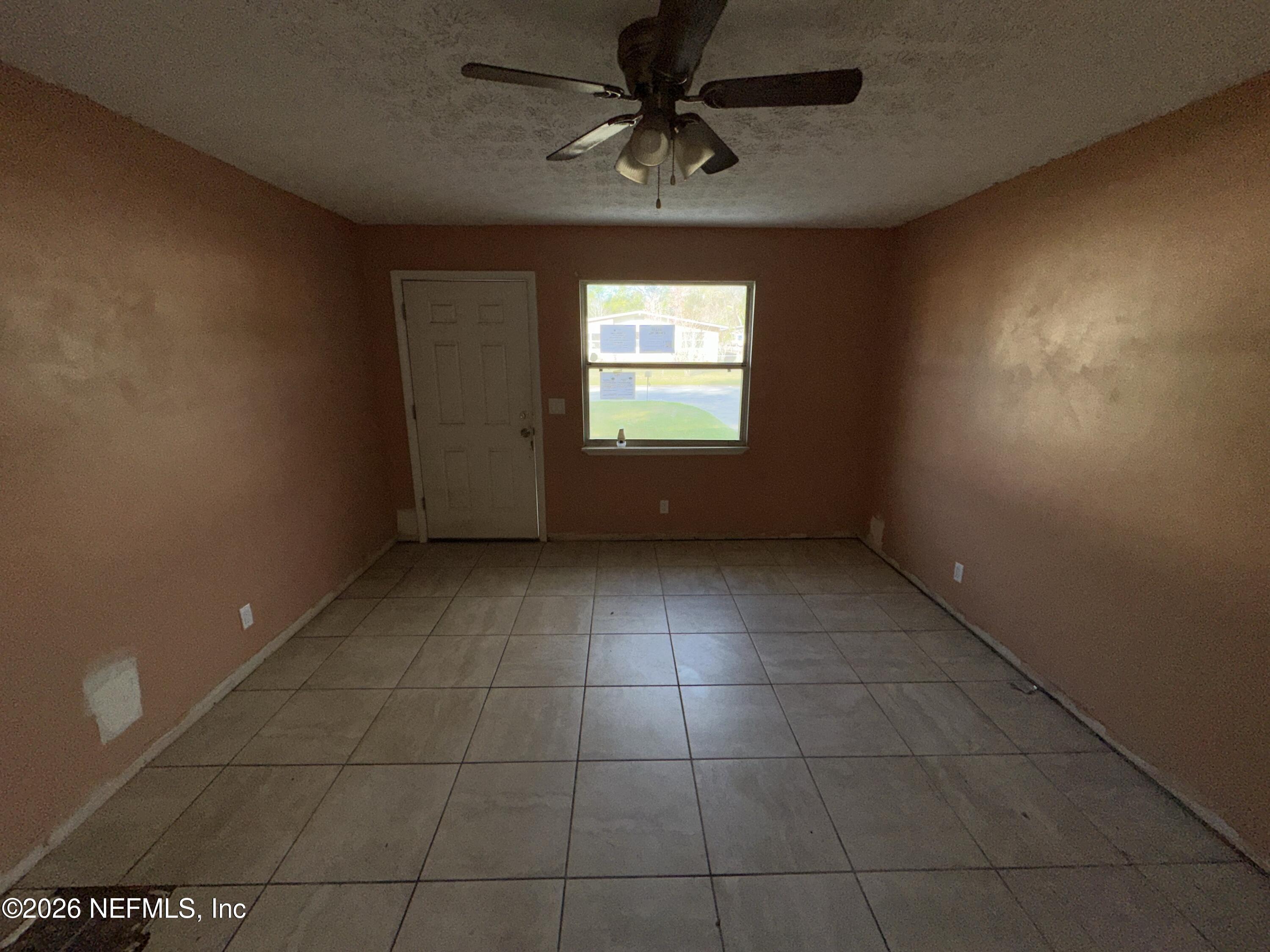 4435 Rainer Road Jacksonville, FL 32210 - Photo 4 of 14 a view of an empty room with a window