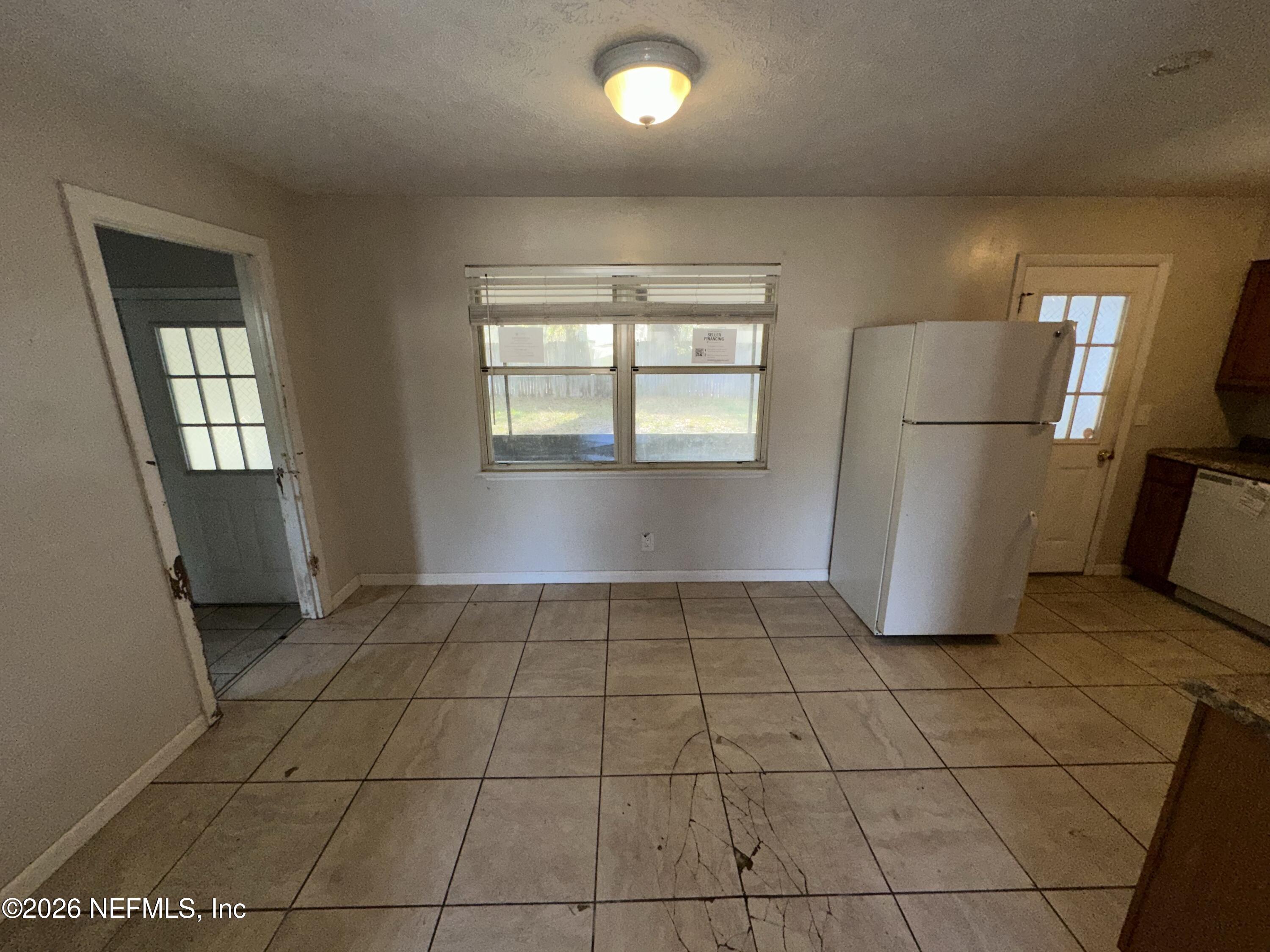 4435 Rainer Road Jacksonville, FL 32210 - Photo 5 of 14 a view of an empty room with a window