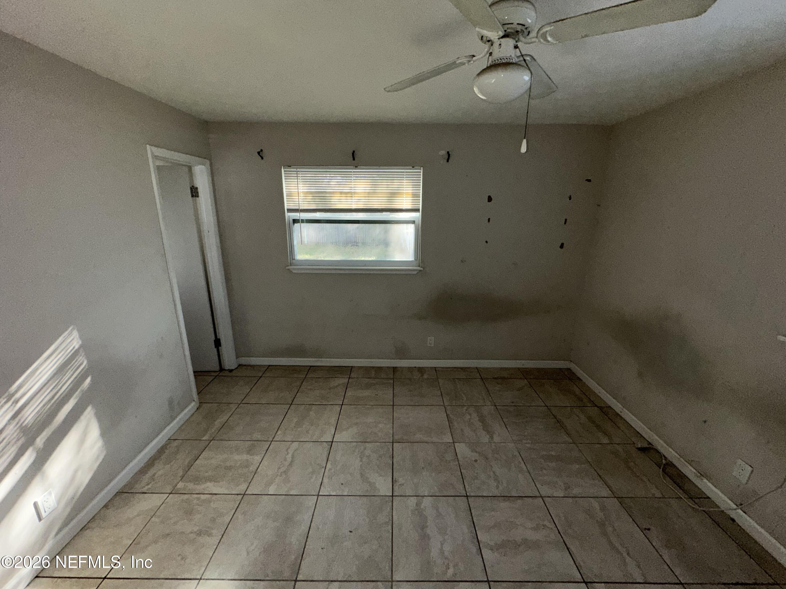4435 Rainer Road Jacksonville, FL 32210 - Photo 9 of 14 a view of an empty room with a window