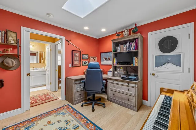 a workspace with furniture and wooden floor
