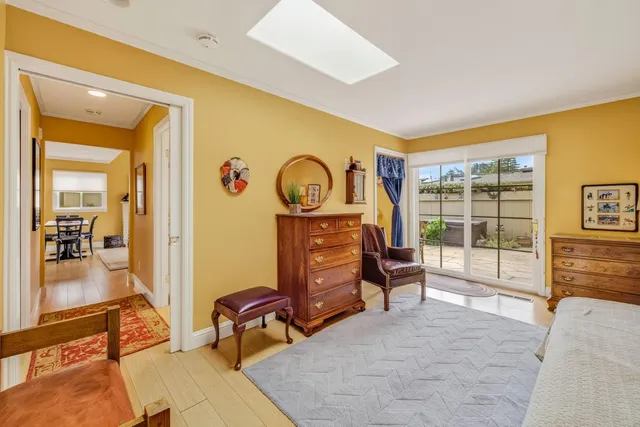 a bedroom with furniture and a window