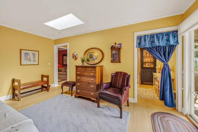 a bedroom with furniture and a chair