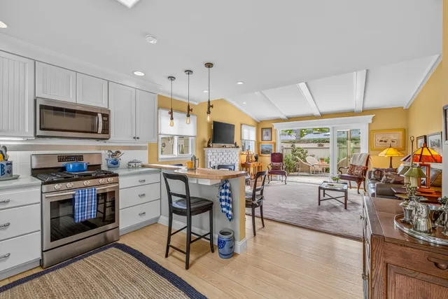 a view of a kitchen and dining room