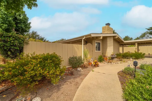 a front view of a house with lake view