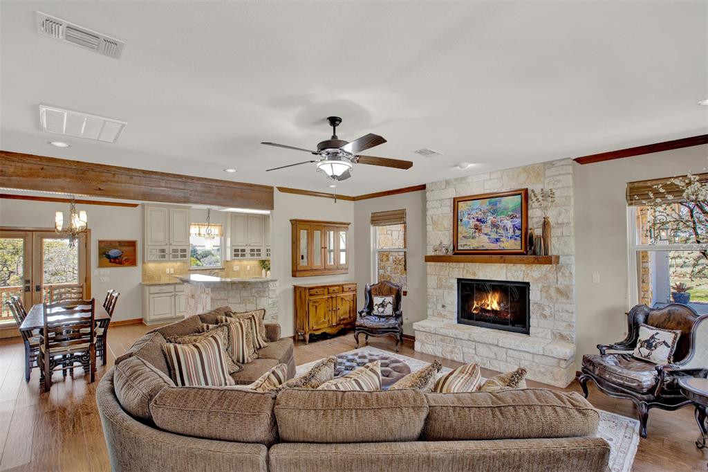 5255 Lookout Ridge Drive Marble Falls, TX 78654 - Photo 6 of 40 Living room with fireplace, dining, breakfast bar