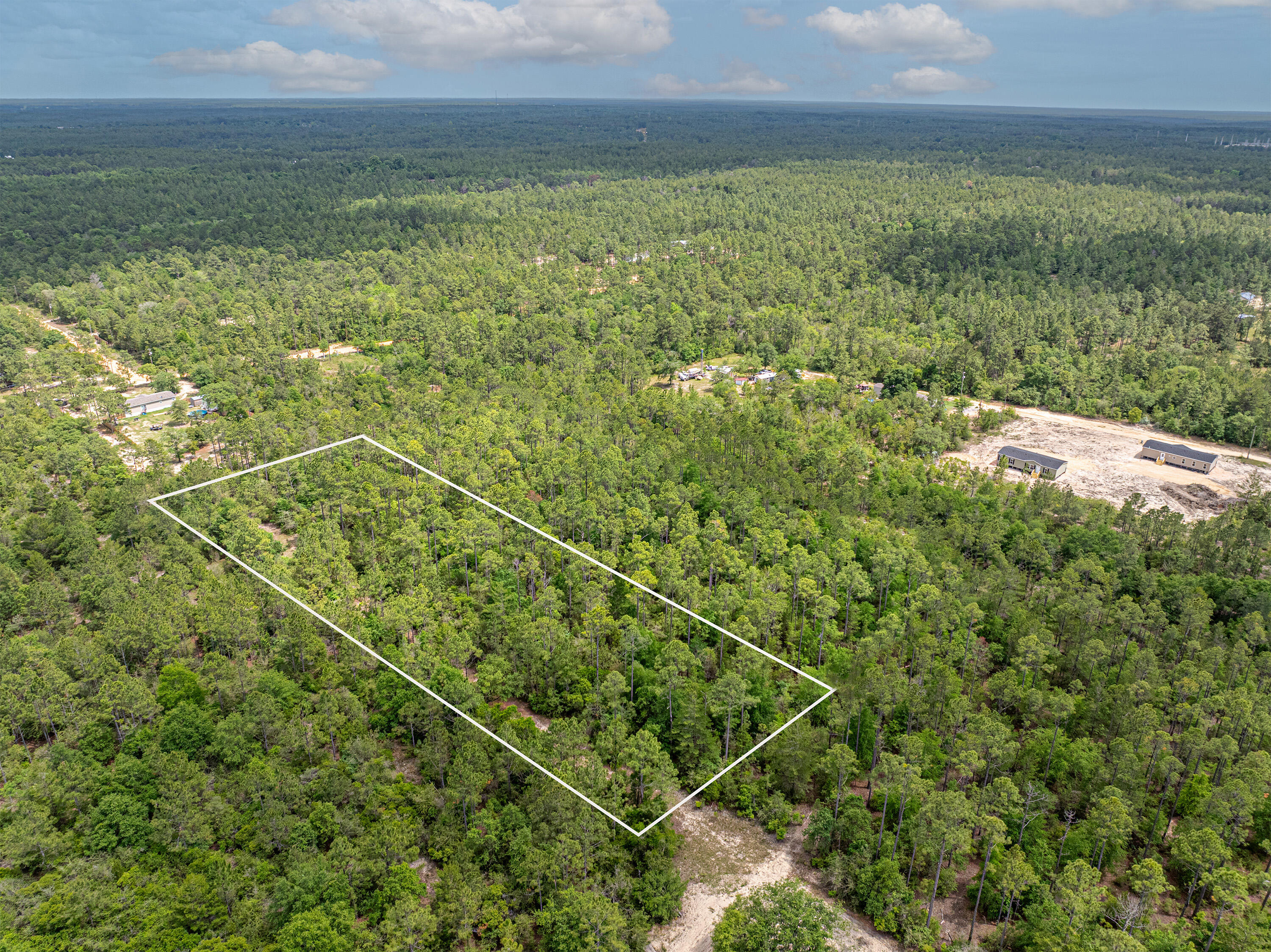 2.5-acres Coventry Road, Unit LOT A DeFuniak Springs, FL 32433 - Photo 2 of 8 a view of a field with an ocean
