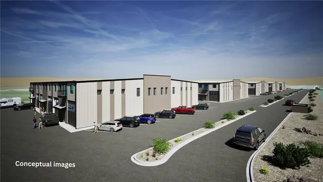 a view of street with tall buildings