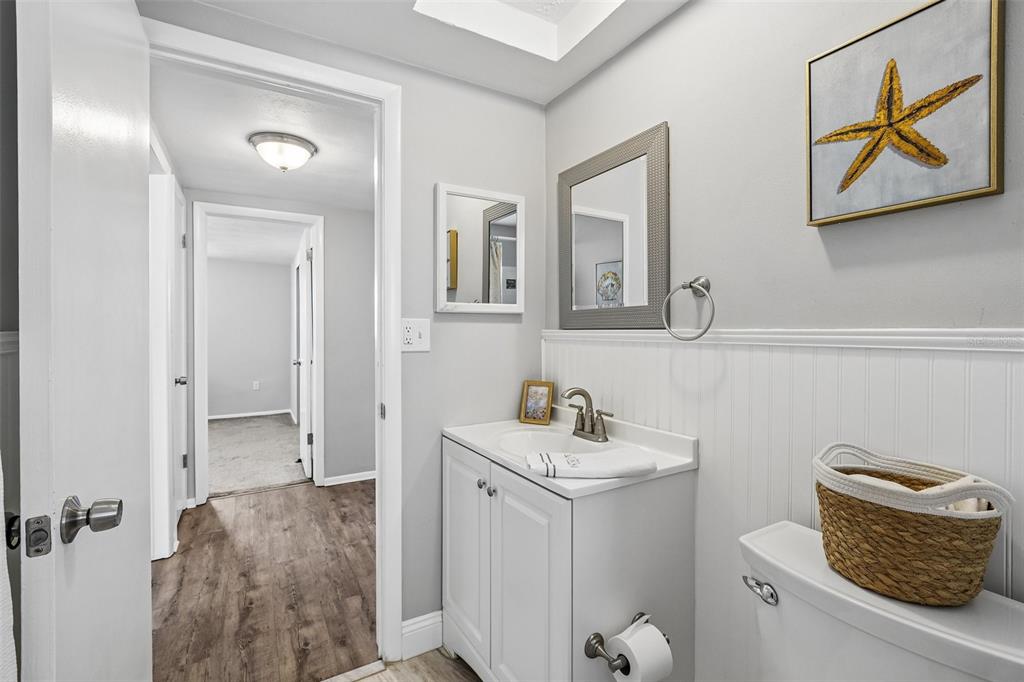 7215 Mayfield Drive Port Richey, FL 34668 - Photo 39 of 52 a bathroom with a sink toilet and mirror