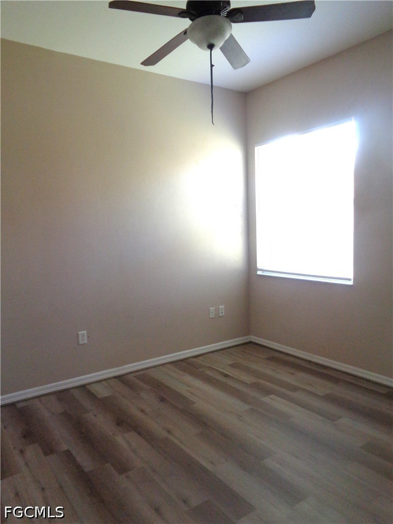 2463 Nature Pointe Loop Fort Myers, FL 33905 - Photo 39 of 50 an empty room with a ceiling fan and window