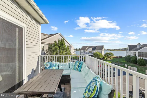 a view of a balcony with wooden floor