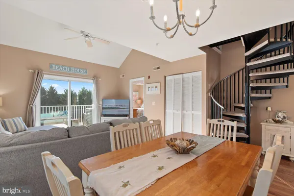 a dining room with furniture and windows