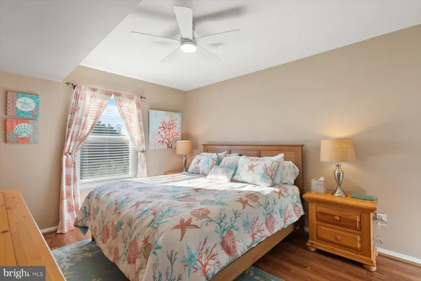 a bedroom with a bed and a dresser in it