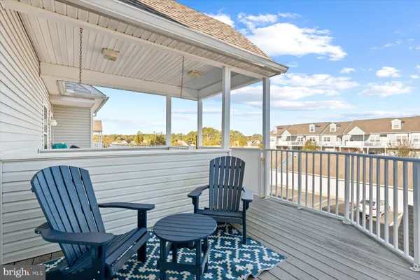 a view of balcony with wooden floor