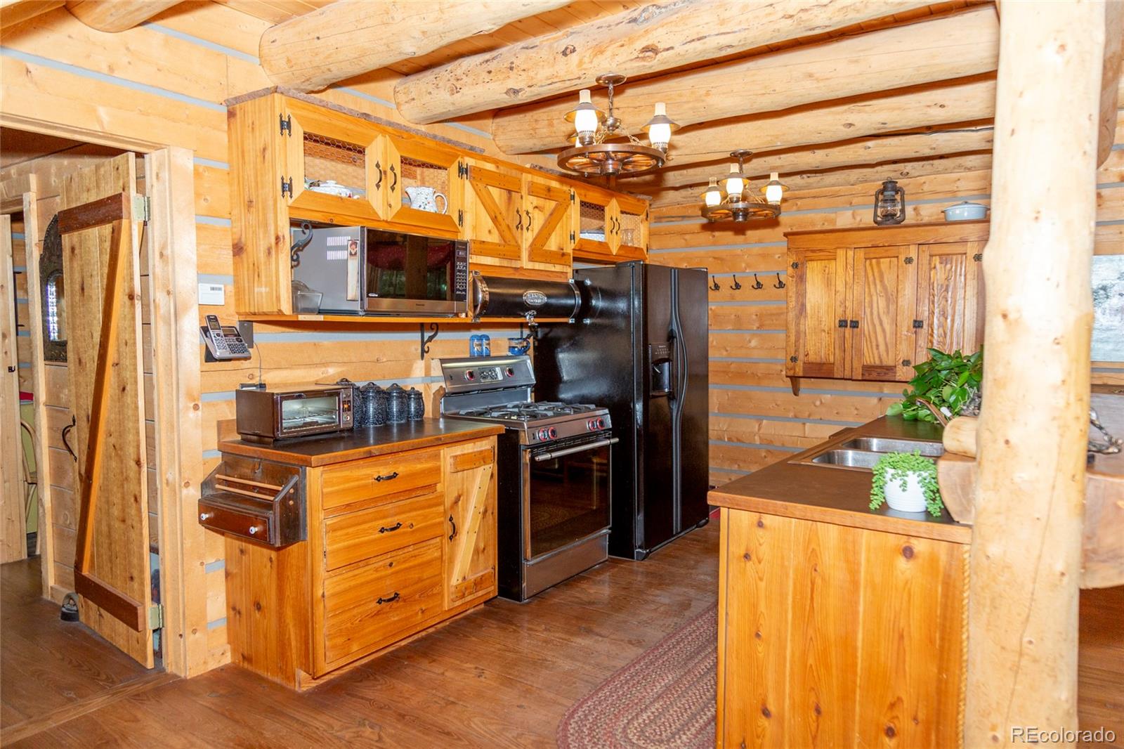 2150 Usfs Road, Unit 18A Creede, CO 81130 - Photo 16 of 25 a view of a kitchen with stainless steel appliances granite countertop a refrigerator and a stove top oven