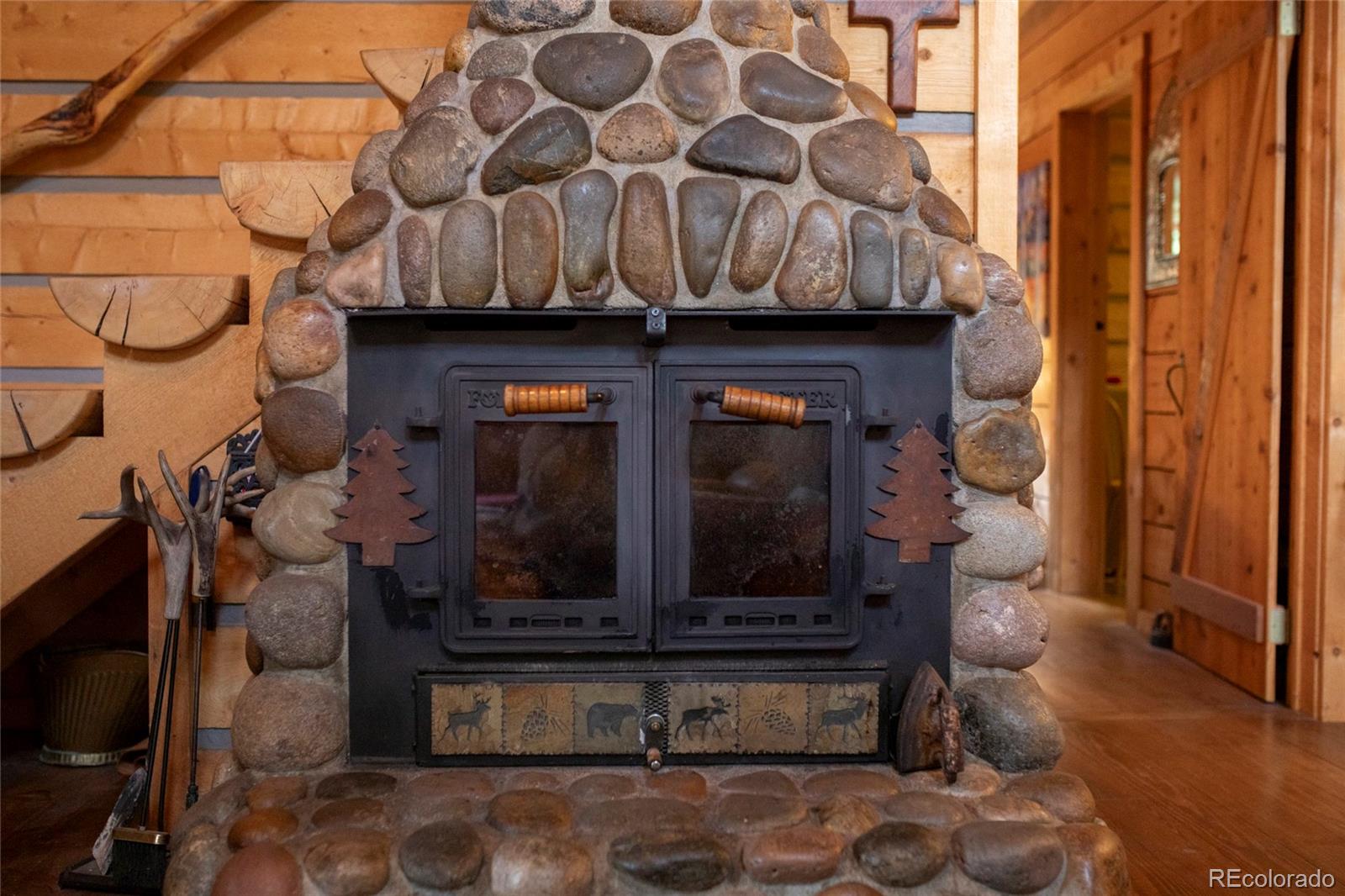 2150 Usfs Road, Unit 18A Creede, CO 81130 - Photo 19 of 25 a living room with furniture and a fireplace