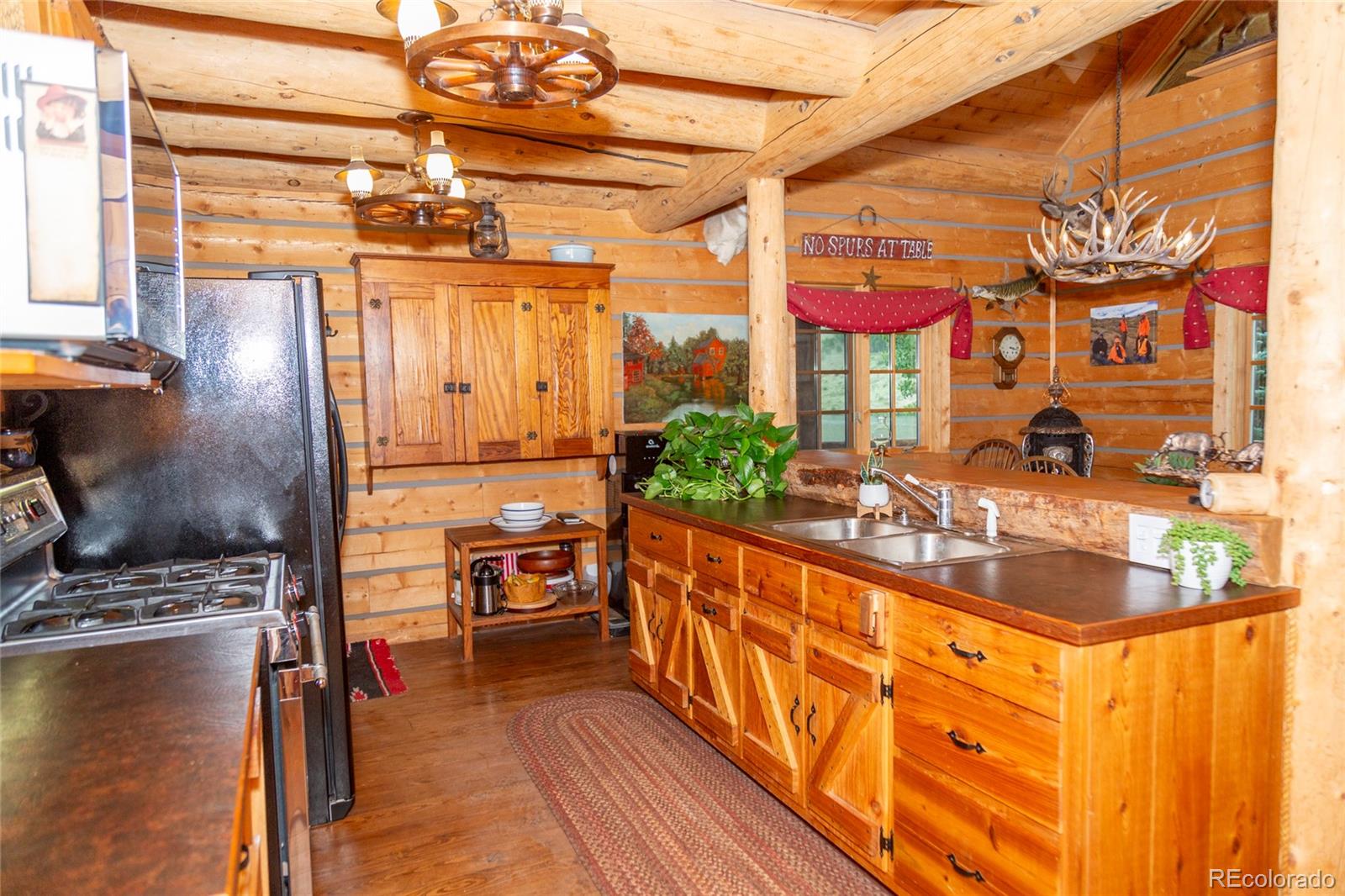 2150 Usfs Road, Unit 18A Creede, CO 81130 - Photo 2 of 25 a view of a swimming pool with a chair and tables in the patio