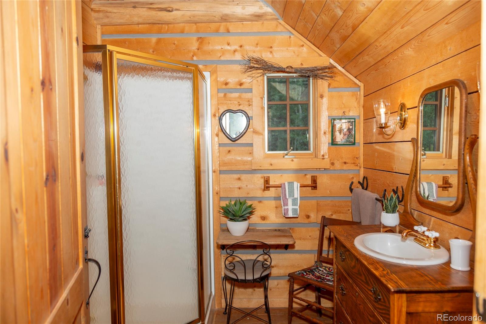 2150 Usfs Road, Unit 18A Creede, CO 81130 - Photo 24 of 25 a bathroom with a sink and a mirror