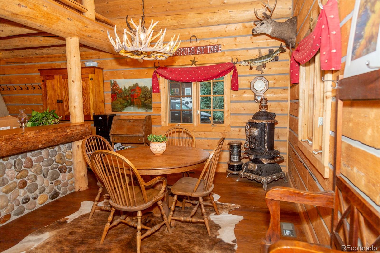2150 Usfs Road, Unit 18A Creede, CO 81130 - Photo 5 of 25 a table and chairs in front of a building
