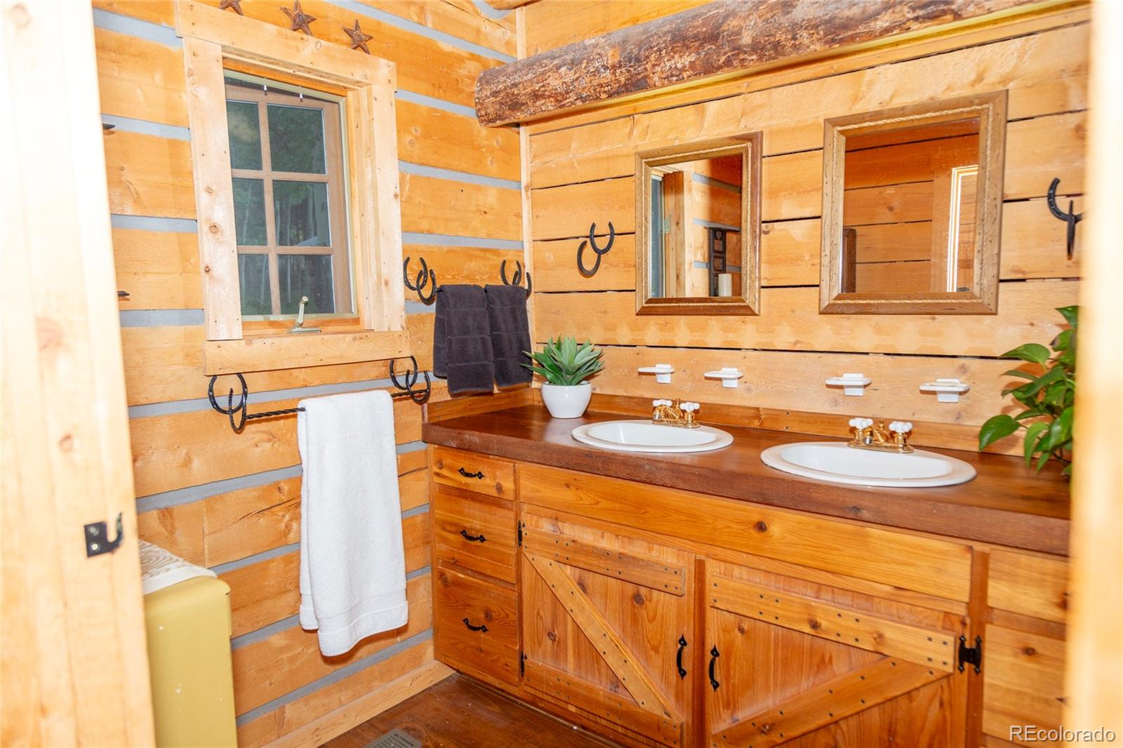 2150 Usfs Road, Unit 18A Creede, CO 81130 - Photo 7 of 25 a bathroom with a sink and a window