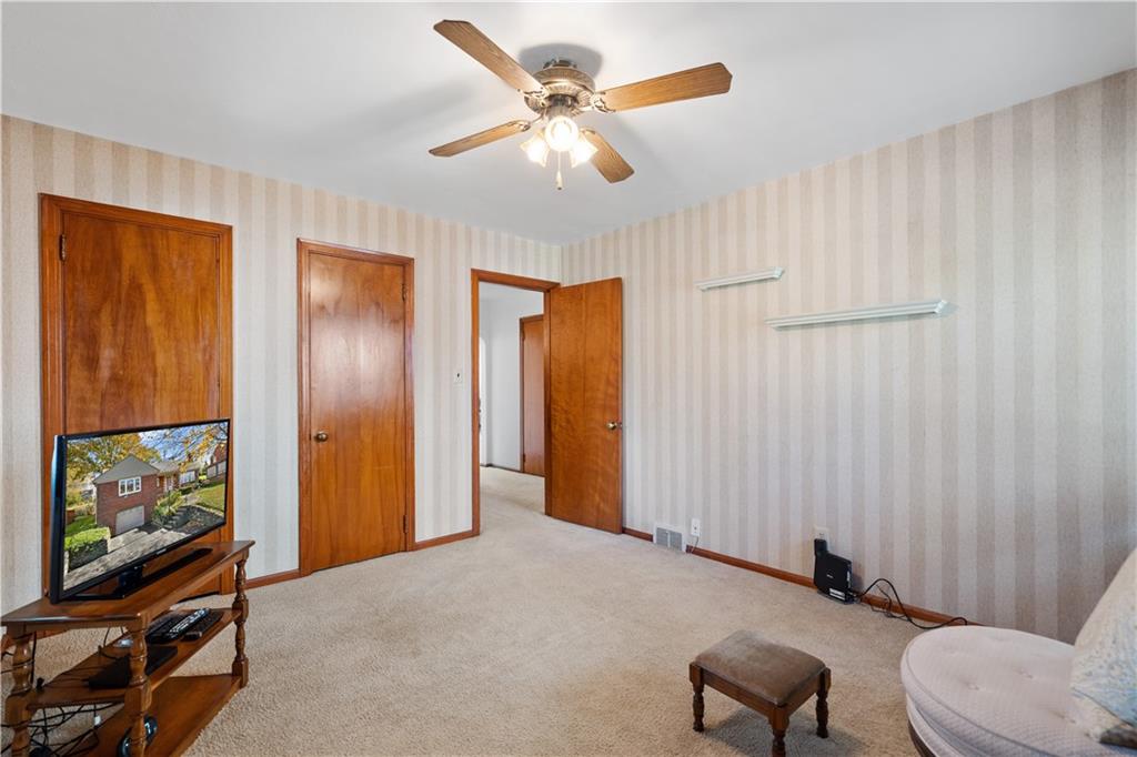 227 Old Clairton Road Pittsburgh, PA 15236 - Photo 11 of 22 a view of a livingroom with furniture and a flat screen tv