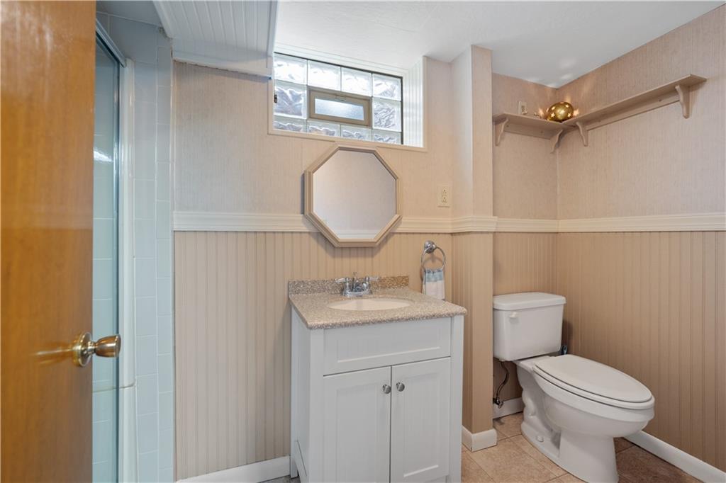 227 Old Clairton Road Pittsburgh, PA 15236 - Photo 12 of 22 a bathroom with a toilet sink vanity and mirror