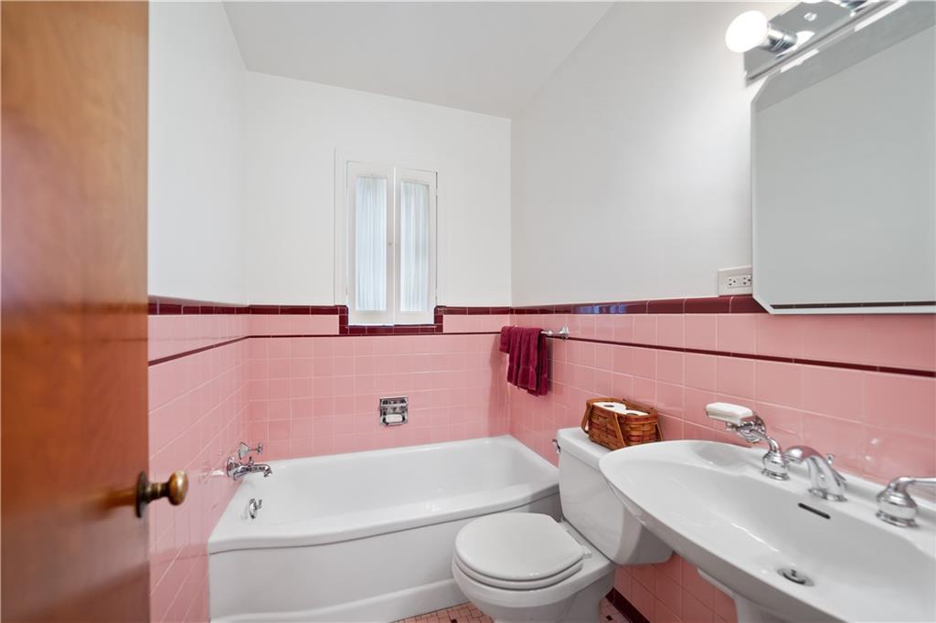 227 Old Clairton Road Pittsburgh, PA 15236 - Photo 16 of 22 a bathroom with a sink a toilet and bathtub