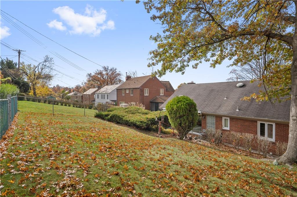 227 Old Clairton Road Pittsburgh, PA 15236 - Photo 19 of 22 a view of a house with a yard